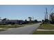 A peaceful street view showcasing a quiet residential neighborhood at 8158 Trionfo Ave, North Port, FL 34287