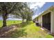 Backyard view from patio shows fence and view over green space at 8866 Tuscany Isles Dr, Punta Gorda, FL 33950