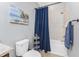 Bathroom featuring a toilet, a tub with a shower, and a storage shelf at 8866 Tuscany Isles Dr, Punta Gorda, FL 33950