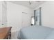 Comfortable bedroom with soft carpet, a window, and minimalist decor at 8866 Tuscany Isles Dr, Punta Gorda, FL 33950