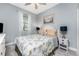Serene bedroom featuring a window, a soft color palette, and elegant furnishings at 8866 Tuscany Isles Dr, Punta Gorda, FL 33950