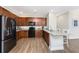 Spacious kitchen boasts granite counters, wood cabinets, stainless steel appliances, and lots of natural light at 8866 Tuscany Isles Dr, Punta Gorda, FL 33950