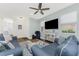 Relaxing living room featuring a ceiling fan, hardwood floors, and access to other rooms at 8866 Tuscany Isles Dr, Punta Gorda, FL 33950