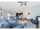 Spacious living room featuring an ottoman, hardwood floors, and an open floor plan at 8866 Tuscany Isles Dr, Punta Gorda, FL 33950