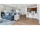Bright and airy living room with stylish furniture, hardwood floors, and modern lighting at 8866 Tuscany Isles Dr, Punta Gorda, FL 33950