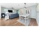 Comfortable living room and dining room combo with hardwood floors and recessed lighting at 8866 Tuscany Isles Dr, Punta Gorda, FL 33950