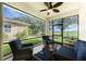 Screened patio with ceiling fan and wicker furniture provides relaxing outdoor living space with great views at 8866 Tuscany Isles Dr, Punta Gorda, FL 33950