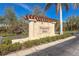 Elegant Tuscany Isles community sign surrounded by meticulously manicured landscaping, providing a distinguished entry at 8866 Tuscany Isles Dr, Punta Gorda, FL 33950