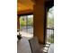 Inviting balcony featuring black railings, outdoor seating, and views of landscaped grounds with vibrant foliage at 96 Vivante Blvd # 9622, Punta Gorda, FL 33950