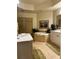 Elegant bathroom featuring a large soaking tub, separate shower, and double vanity sinks at 96 Vivante Blvd # 9622, Punta Gorda, FL 33950