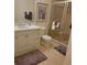 Well-lit bathroom with white vanity, framed art and glass shower, providing a clean and functional space at 96 Vivante Blvd # 9622, Punta Gorda, FL 33950