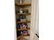Bathroom closet featuring wooden shelves and ample storage space for toiletries and personal items at 96 Vivante Blvd # 9622, Punta Gorda, FL 33950