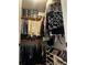 Walk-in closet features custom shelving, hanging rods, and ample space for clothes and accessories at 96 Vivante Blvd # 9622, Punta Gorda, FL 33950