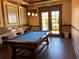 Game room with a pool table, bar seating, and stylish decor, offering a fun and entertaining space at 96 Vivante Blvd # 9622, Punta Gorda, FL 33950