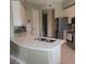 Bright kitchen features stainless steel appliances, white cabinetry, and sleek countertops at 96 Vivante Blvd # 9622, Punta Gorda, FL 33950