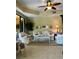 Bright living room with elegant decor, tile floors, and access to a balcony, offering a serene living space at 96 Vivante Blvd # 9622, Punta Gorda, FL 33950