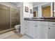 Bathroom with tiled walk-in shower and vanity with ample storage and stylish finishes at 99 Vivante Blvd # 310, Punta Gorda, FL 33950