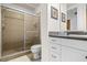 Bright bathroom features a spacious shower with tile surround and vanity with storage at 99 Vivante Blvd # 310, Punta Gorda, FL 33950