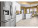Bright kitchen features stainless steel appliances, white cabinetry, and a breakfast nook with natural light at 99 Vivante Blvd # 310, Punta Gorda, FL 33950