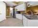 Well-equipped kitchen features stainless steel appliances, white cabinetry, and ample counter space at 99 Vivante Blvd # 310, Punta Gorda, FL 33950