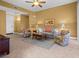 Comfortable living room features neutral decor, ceiling fan, and bright, natural light at 99 Vivante Blvd # 310, Punta Gorda, FL 33950