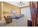 Cozy living room features comfortable seating, neutral decor and a ceiling fan at 99 Vivante Blvd # 310, Punta Gorda, FL 33950