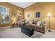 Cozy living room featuring neutral tones, comfortable seating, and plenty of natural light at 99 Vivante Blvd # 310, Punta Gorda, FL 33950