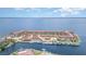 Panoramic aerial of waterfront condominium complex with boat docks, pool, and stunning bay views at 1 Colony Point Dr # B20, Punta Gorda, FL 33950