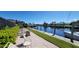 Scenic waterfront with boat dock, outdoor seating area, and beautiful canal views at 1 Colony Point Dr # B20, Punta Gorda, FL 33950