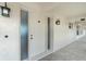 Inviting entrance with classic white door, frosted glass sidelight, and stylish exterior lighting at 1 Colony Point Dr # B20, Punta Gorda, FL 33950
