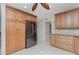 The bright kitchen with wooden cabinets features a stainless steel refrigerator and granite countertops at 1 Colony Point Dr # B20, Punta Gorda, FL 33950
