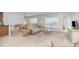 Bright, neutral living room featuring comfortable seating, water views, and a dining area at 1 Colony Point Dr # B20, Punta Gorda, FL 33950