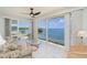 Living room with large windows providing natural light and a view of the bay at 1 Colony Point Dr # B20, Punta Gorda, FL 33950