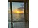 Sunset view of the open water from a large window at 1 Colony Point Dr # B20, Punta Gorda, FL 33950