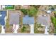 Overhead shot of a house with a gray roof, driveway, and lawn in a residential neighborhood at 1210 Mccrory St, North Port, FL 34286