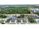 Residential neighborhood featuring single-story homes, driveways, lawns, and mature trees at 1210 Mccrory St, North Port, FL 34286
