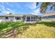 Well-maintained backyard features a screened-in porch at 1210 Mccrory St, North Port, FL 34286