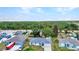 Charming single-story home featuring a well-maintained yard, driveway, and a modern roof design at 1210 Mccrory St, North Port, FL 34286
