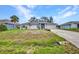 Charming single-story home with a long driveway and well-manicured lawn at 1210 Mccrory St, North Port, FL 34286