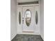 Close up of the front door, featuring decorative glass and panels at 1210 Mccrory St, North Port, FL 34286