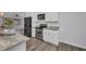 Bright kitchen featuring modern stainless steel appliances and granite countertops at 1210 Mccrory St, North Port, FL 34286