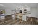 Open-concept living space featuring modern finishes and bar seating at 1210 Mccrory St, North Port, FL 34286