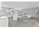 Bright new kitchen featuring white cabinets and countertop, windows for natural light, and sliding glass doors at 12299 Albrecht Ter, Port Charlotte, FL 33981