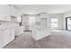 Modern kitchen with white cabinets and an island, offering a clean and spacious design at 12299 Albrecht Ter, Port Charlotte, FL 33981
