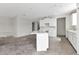 Spacious kitchen features a large island, bright cabinets, and modern design elements at 12299 Albrecht Ter, Port Charlotte, FL 33981