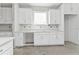 Bright kitchen with white cabinets, a large window, and updated countertops in a modern home at 12299 Albrecht Ter, Port Charlotte, FL 33981