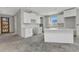 New kitchen features bright cabinets, white countertops and island, ready to be personalized at 12299 Albrecht Ter, Port Charlotte, FL 33981