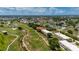 Scenic aerial view of condos near golf course and water features at 1236 Rio De Janeiro Ave # 406, Punta Gorda, FL 33983