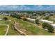 Scenic aerial view of condos near a golf course and winding stream at 1236 Rio De Janeiro Ave # 406, Punta Gorda, FL 33983