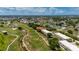 Expansive aerial view of a meticulously maintained golf course community, with lush greenery and beautiful landscaping at 1236 Rio De Janeiro Ave # 406, Punta Gorda, FL 33983